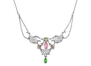 An Edwardian Paste Necklace the scroll and garland motifs set throughout with round cut colourless