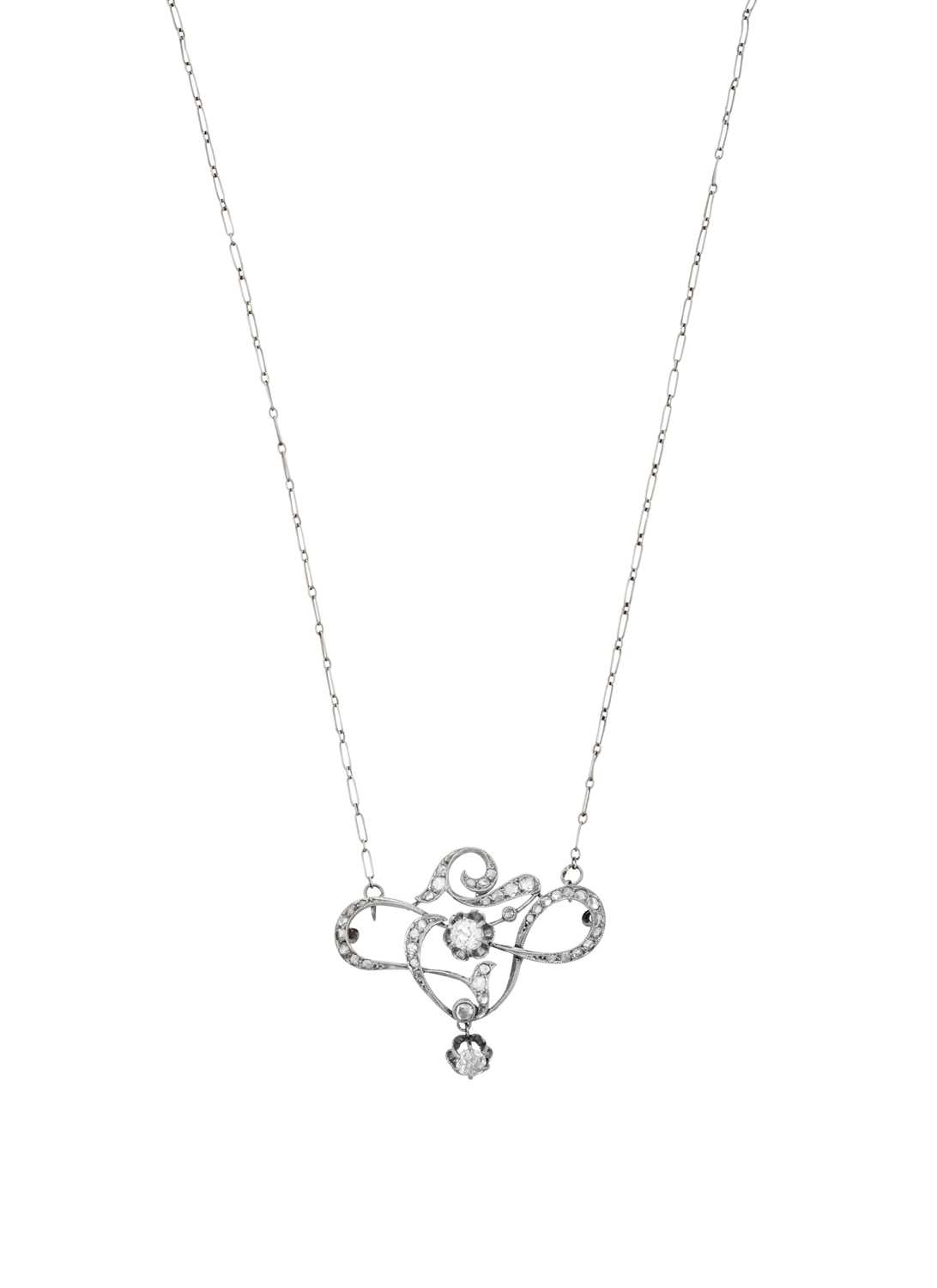 A Diamond Necklace of openwork scroll form, set throughout with old cut and rose cut diamonds, in