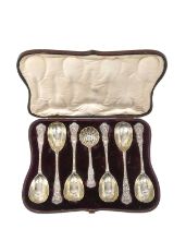 A Cased Set of Six Victorian Parcel-Gilt Silver Berry-Spoons and a Sifting Spoon, by Henry John Lia