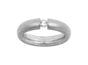 An 18 Carat White Gold Diamond Solitaire Ring the round brilliant cut diamond in a tension