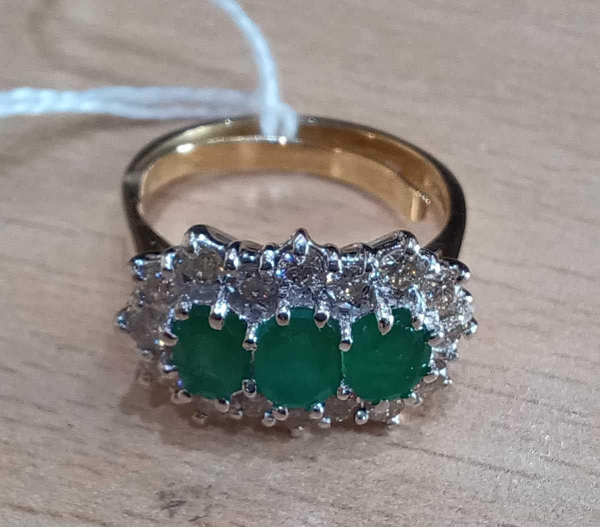 An 18 Carat Gold Emerald and Diamond Triple Cluster Ring three graduated oval cut emeralds within - Image 4 of 4