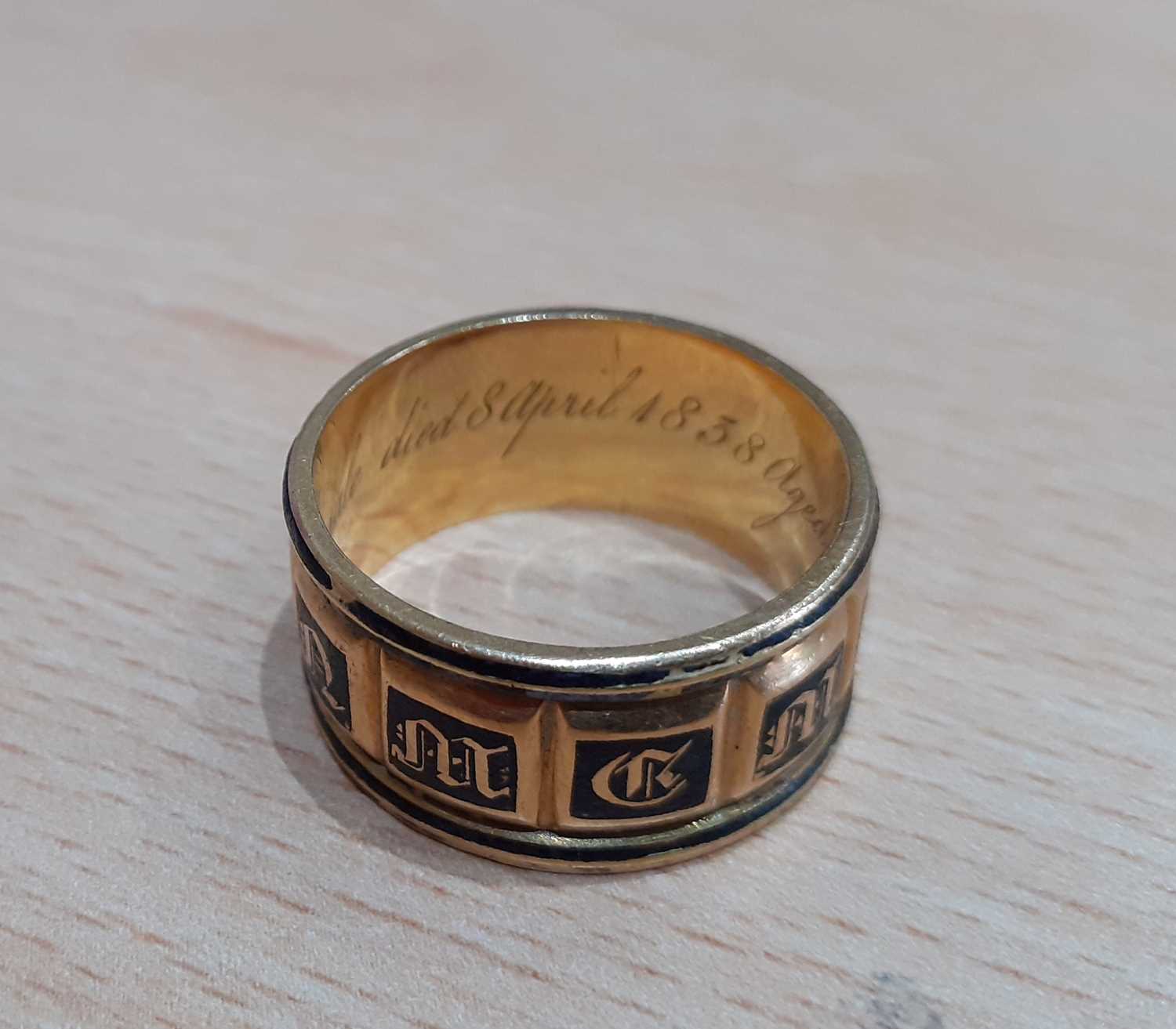 An 18 Carat Gold Enamel Mourning Ring the yellow broad band enamelled in black to read IN MEMORY OF, - Image 4 of 7