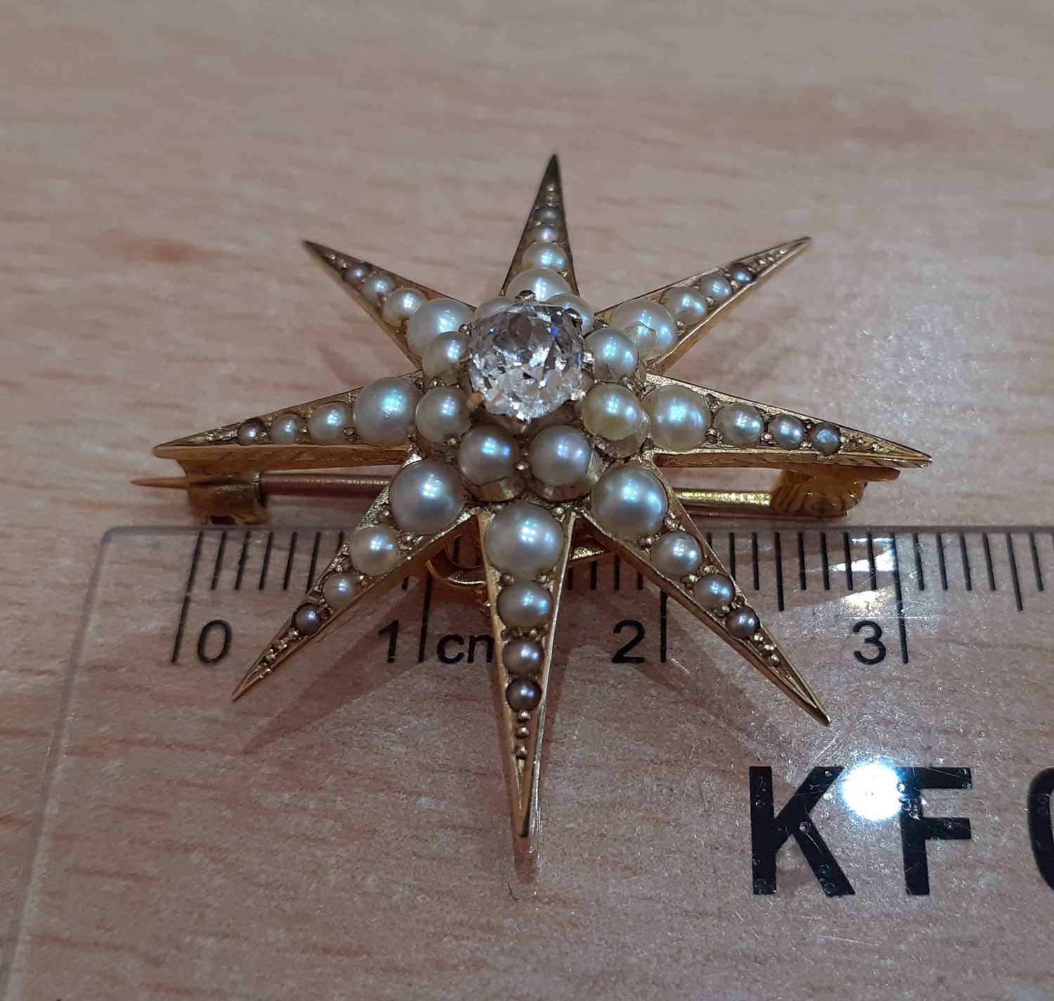 A Late 19th Century Diamond and Split Pearl Brooch/Pendant realistically modelled as an eight - Image 2 of 4