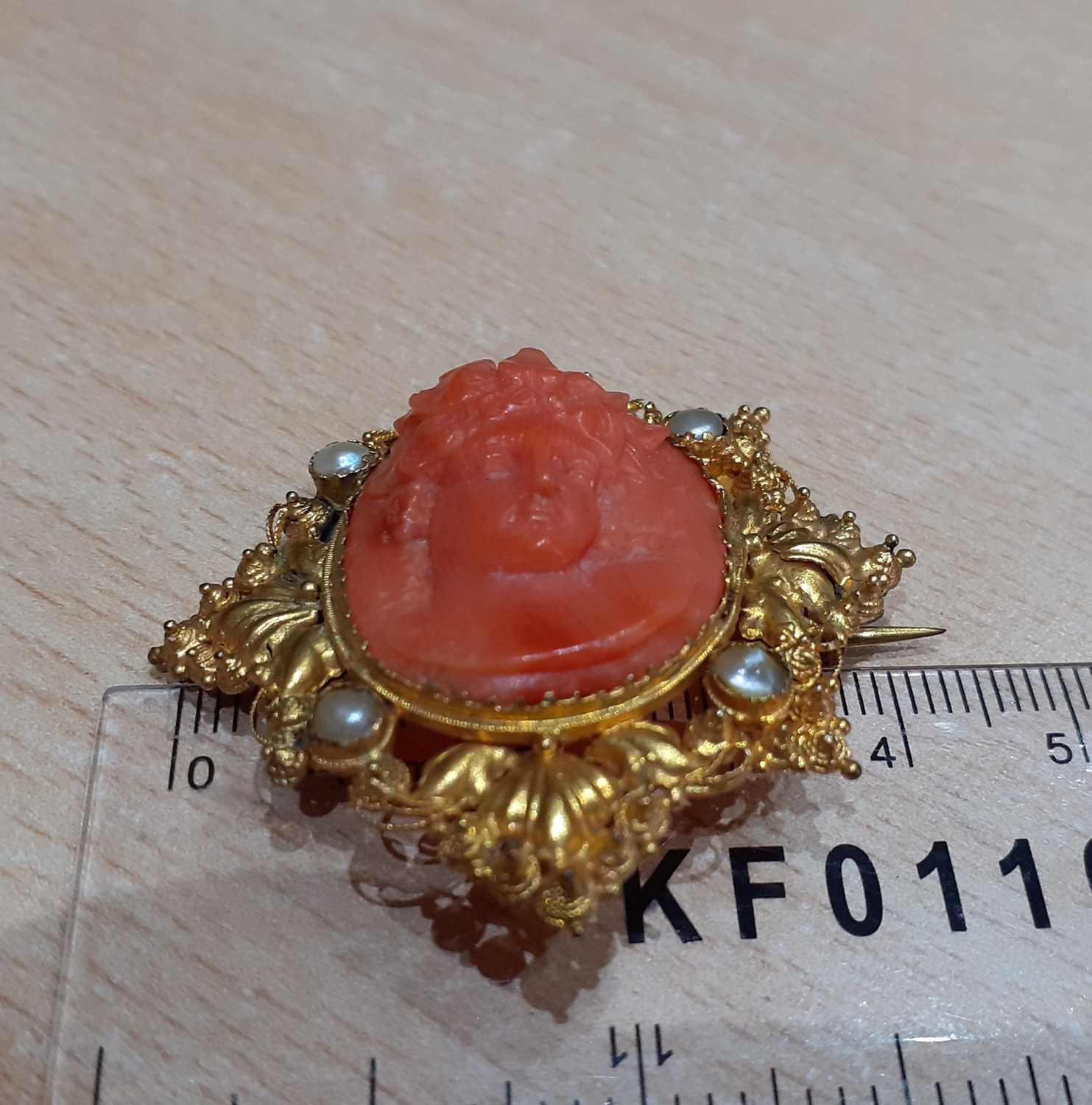 A Late 19th Century Coral and Split Pearl Cameo Brooch the coral carved to depict Bacchus, in a - Image 2 of 4