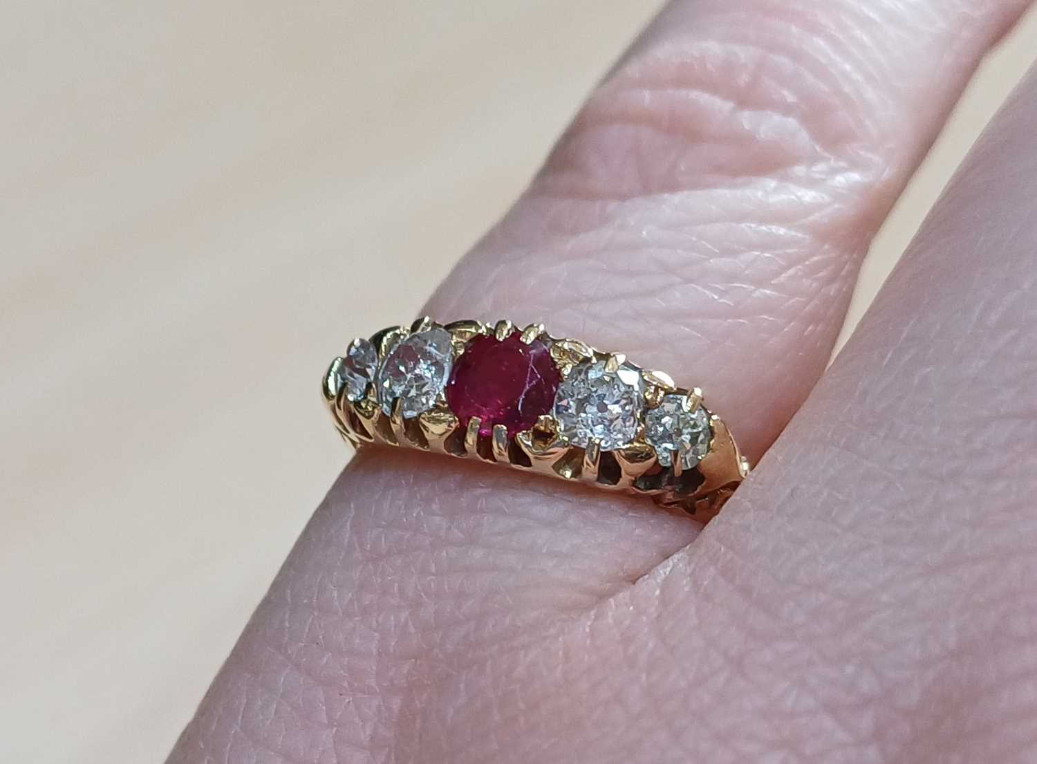 An 18 Carat Gold Ruby and Diamond Five Stone Ring the round cut ruby flanked by graduated old cut - Image 2 of 4