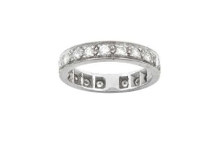 A Diamond Eternity Ring the nineteen round brilliant cut diamonds in white claw and channel