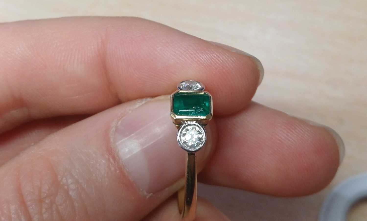 An 18 Carat Gold Emerald and Diamond Three Stone Ring the emerald-cut emerald in a yellow rubbed - Image 6 of 6