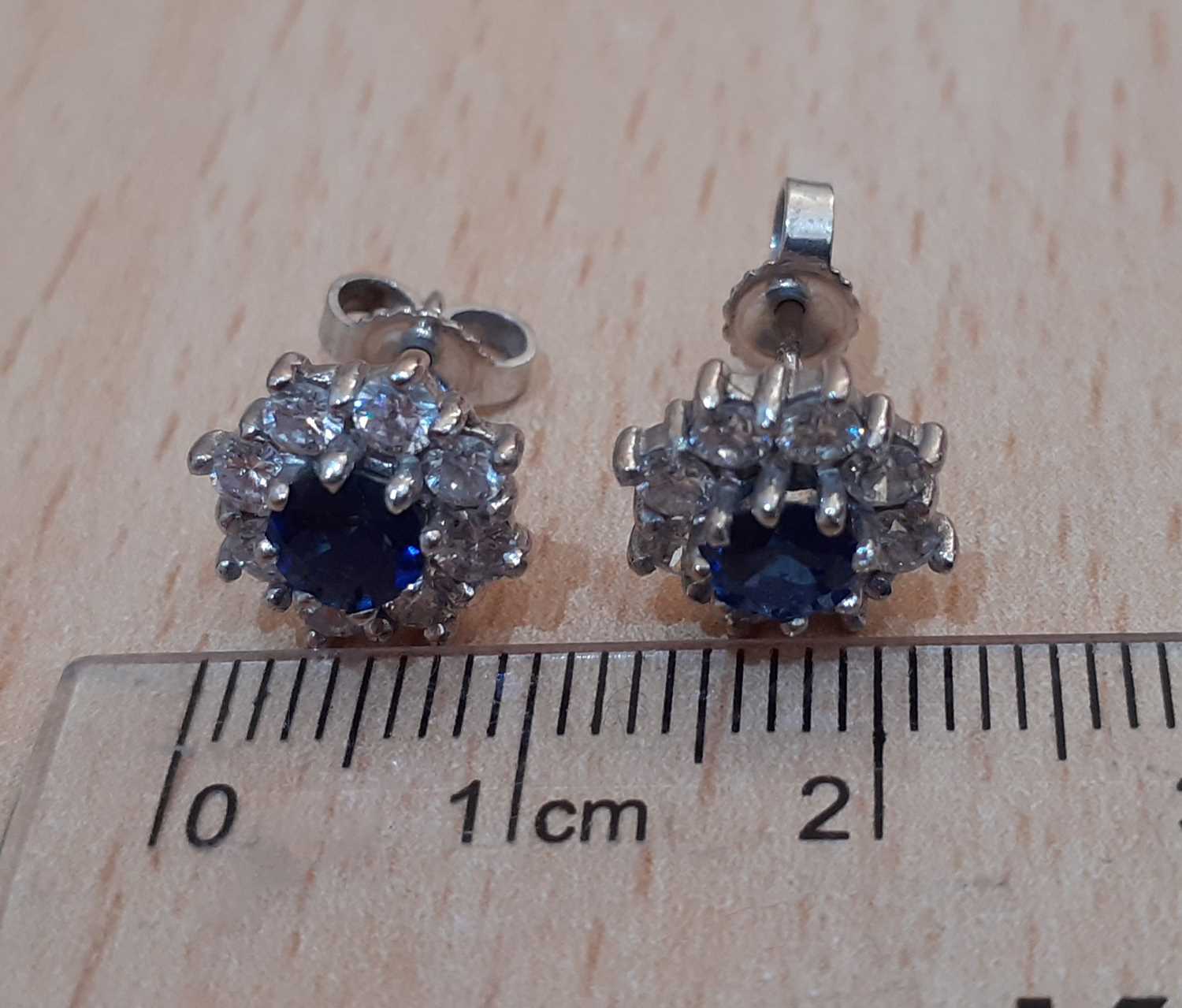 A Pair of 18 Carat White Gold Sapphire and Diamond Cluster Earrings the round cut sapphires within - Image 2 of 3