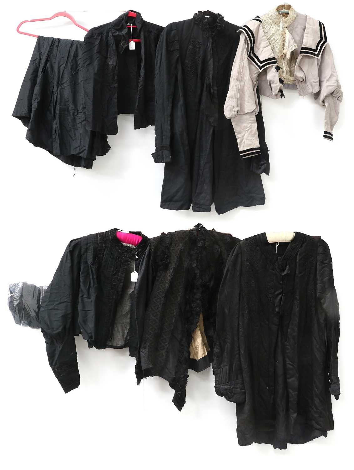Victorian and Edwardian Costume comprising a black silk long jacket with cut collar, trim appliqués,