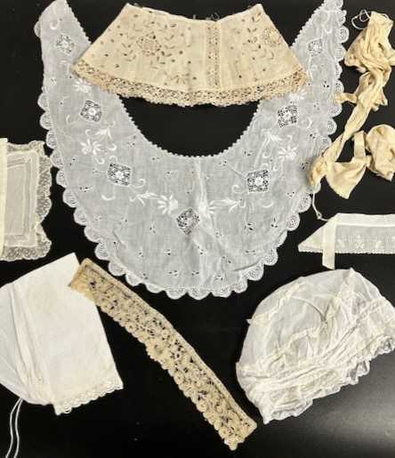 Assorted Embroidered and Lace Costume Accessories, comprising lace caps, black silk apron, cotton - Image 3 of 7