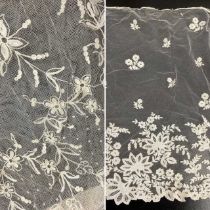 Early 20th Century Lace, comprising an embroidered net skirt mount decorated with floral sprigs,