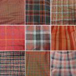Assorted Mainly Red Wool Fabric Lengths, comprising a Trefriw Woollen Mills purple herringbone skirt