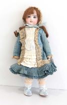 Small Bisque Socket Head Doll with fixed blue eyes, open mouth, teeth, pierced ears, auburn wig,