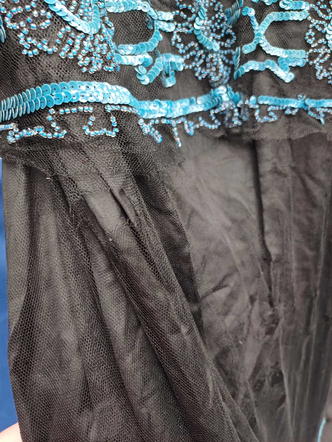 Circa 1920s Ladies Evening Dresses comprising a black silk dress with black net mount, blue sequin - Image 2 of 28