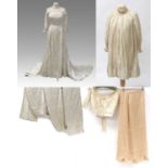 Early 20th Century Costume comprising an ivory silk wedding dress with boat shaped neck, half