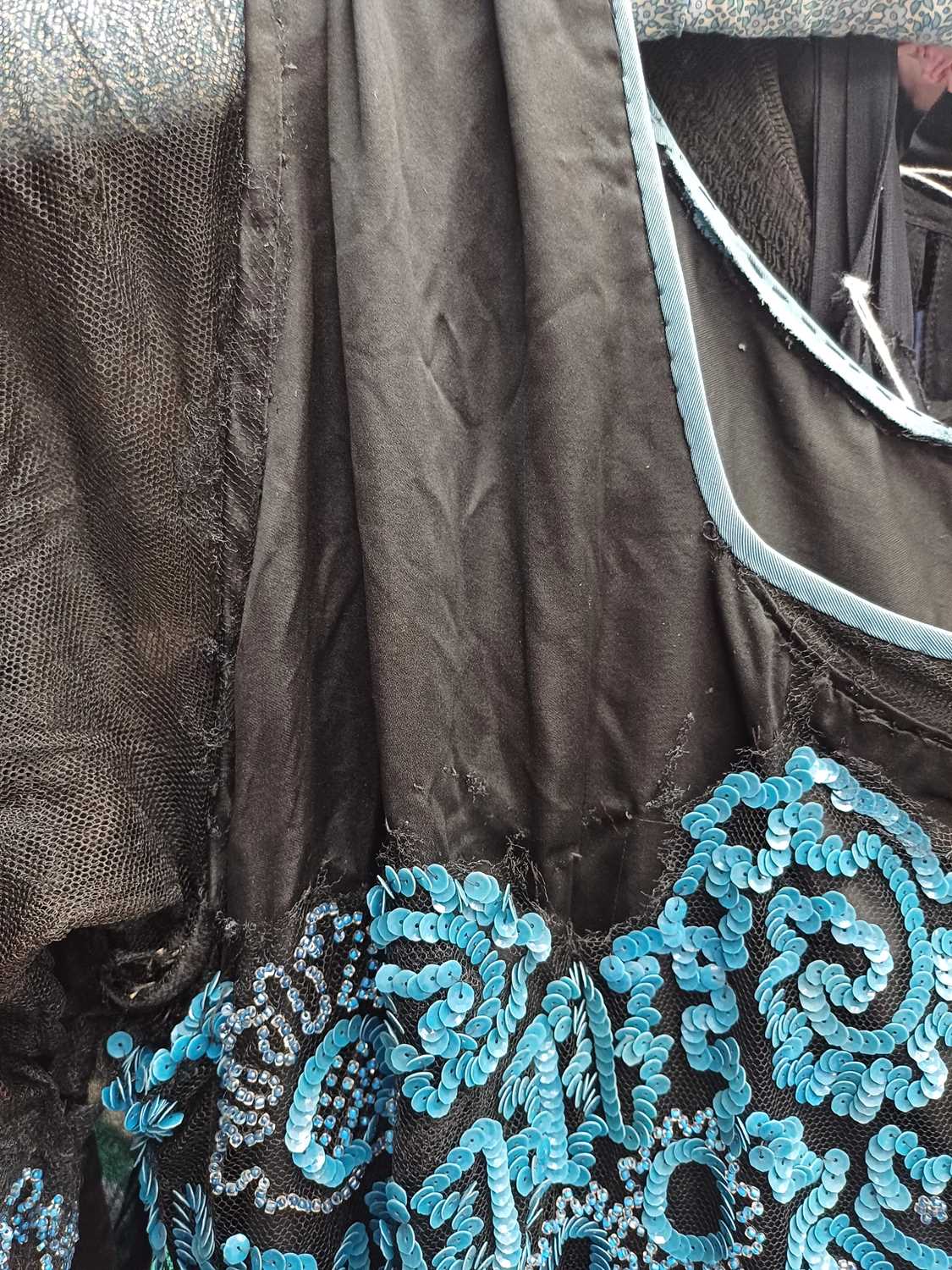Circa 1920s Ladies Evening Dresses comprising a black silk dress with black net mount, blue sequin - Image 12 of 28
