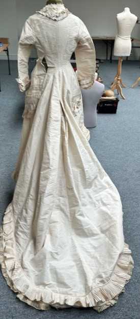 Victorian Cream Silk Wedding Dress with multi pleated trims to the front, cuffs and hem, button - Image 5 of 11