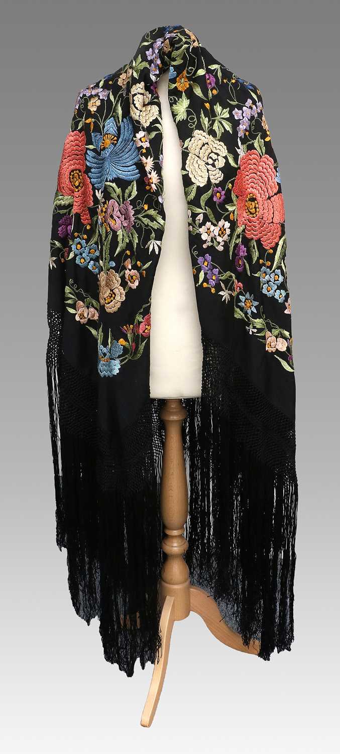 An Early 20th Century Chinese Black Silk Shawl Embroidered with Silk Flower Heads, in various