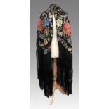 An Early 20th Century Chinese Black Silk Shawl Embroidered with Silk Flower Heads, in various