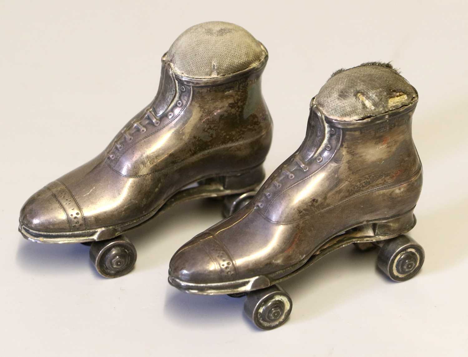 Two Early 20th Century Silver Roller Skate Pin Cushions, Crisford & Norris, Birmingham, 1909, 7cm by