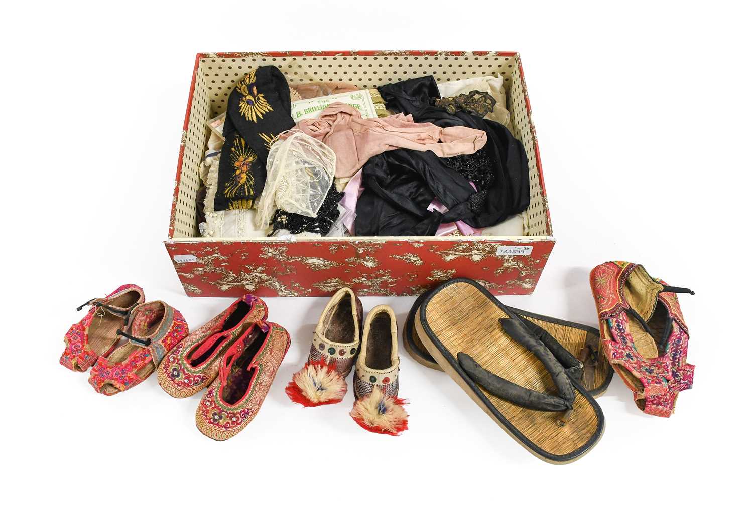 Decorative Textiles and Costume Accessories, comprising a pair of black velvet shoe mounts decorated