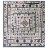 Early 19th Century Patchwork Cover, on a white cotton ground decorated with a central diamond within