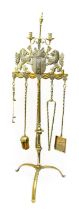 A Dutch Brass Fire Stand, in 17th century style, with urn finial flanked by two candle sconces