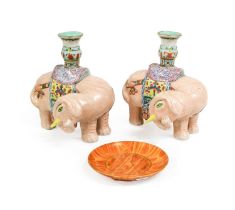 A Pair of Chinese Porcelain Incense Holders, 20th century, as caprisoned elephants, painted in