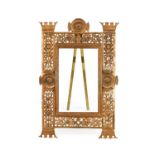 An Aesthetic Movement Gilt-Metal Easel-Back Frame, of vertical rectangular form, pierced and cast