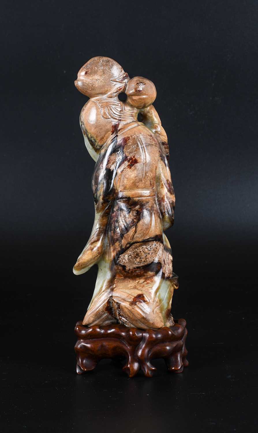 A Chinese Pale Celadon and Mottled Brown Jade Figure of Shoulao, in Ming style, probably late 18th/ - Image 3 of 17