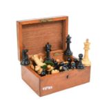 A Staunton Pattern Ebony and Boxwood Chess Set, early 20th century, the kings side rooks and knights
