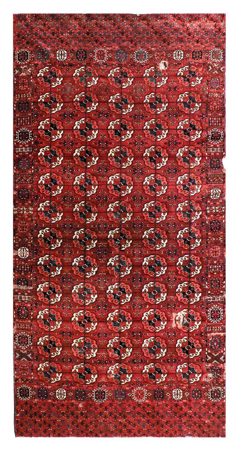 ~ Tekke Main Carpet Probably Merv, late 19th century The rich madder field with five rows of