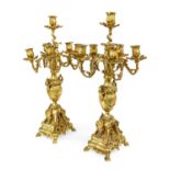 A Pair of Gilt Bronze Six-Light Candelabra, in Louis XV style, with leaf-sheathed sockets and scroll