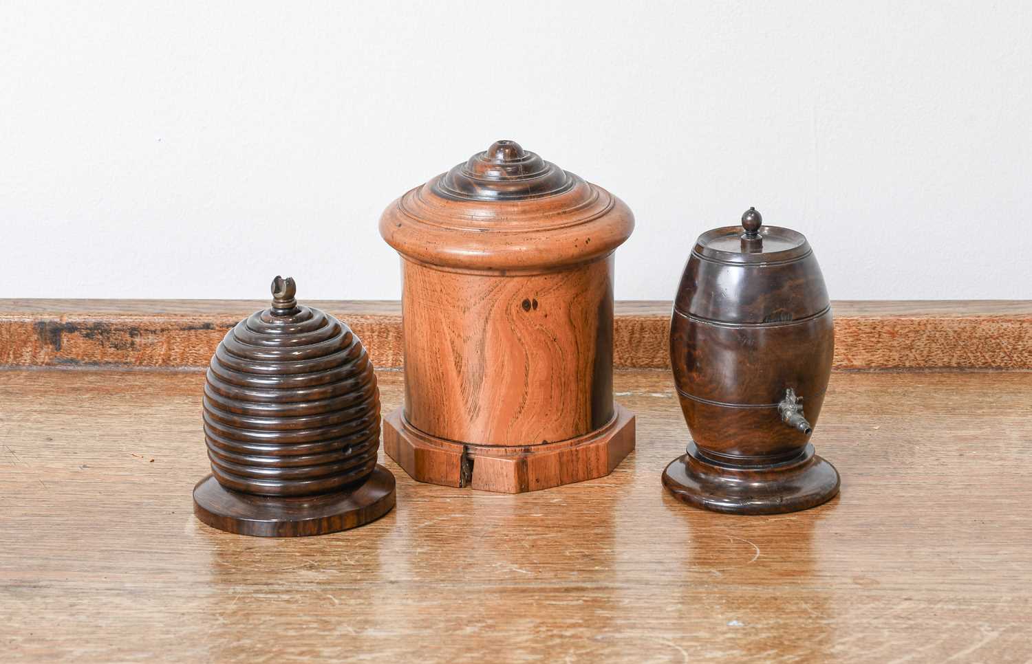 A Lignum Vitae String Box, 19th century, formed as a beehive, with cutter and bevelled plinth 8.