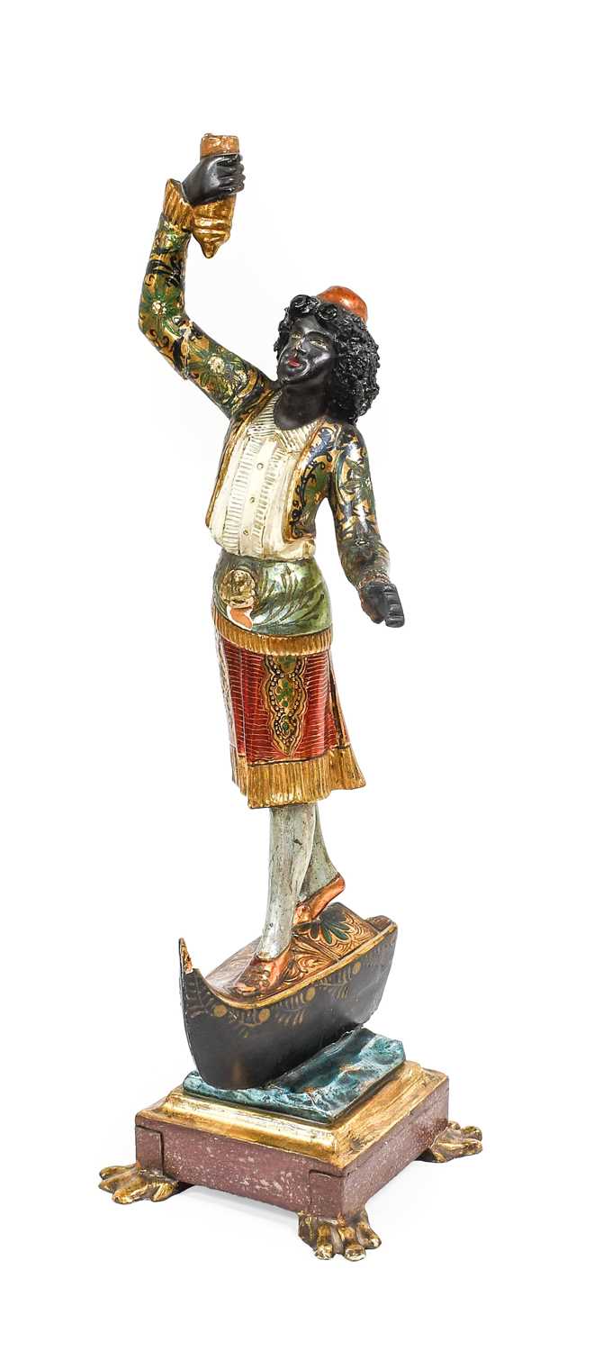 A Venetian Painted and Giltwood Figure of a Blackamoor, late 19th/20th century, standing on the prow