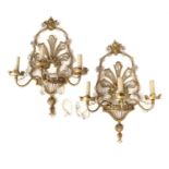 A Set of Four of French Gilt-Metal and Cut-Glass Three-Light Wall Sconces, in Louis XVI style,