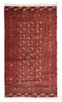 Tekke Rug Emirate of Bukhara, circa 1910 The madder field with three rows of quartered güls enclosed