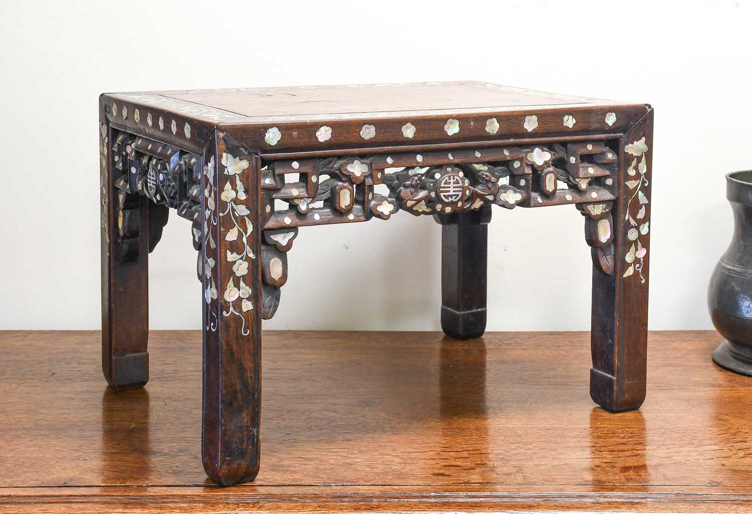 A Chinese Mother-of-Pearl-Inlaid Hardwood Low Table, 19th century, the panelled rectagular top