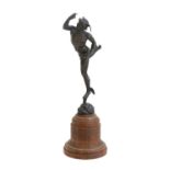 After Giambologna: A Bronze Figure of Mercury, on a turned wood column and circular plinth 36cm