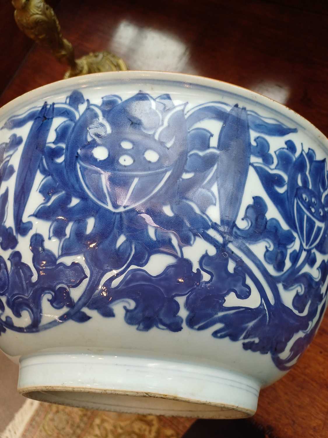 A Chinese Porcelain Punch Bowl, 19th century, with everted rim edged in copper glaze, painted in - Image 6 of 8