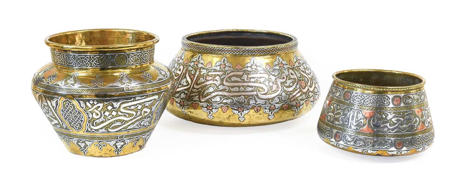 A Cairoware Bowl, late 19th/20th century, of conical form, inlaid in copper and silver with script