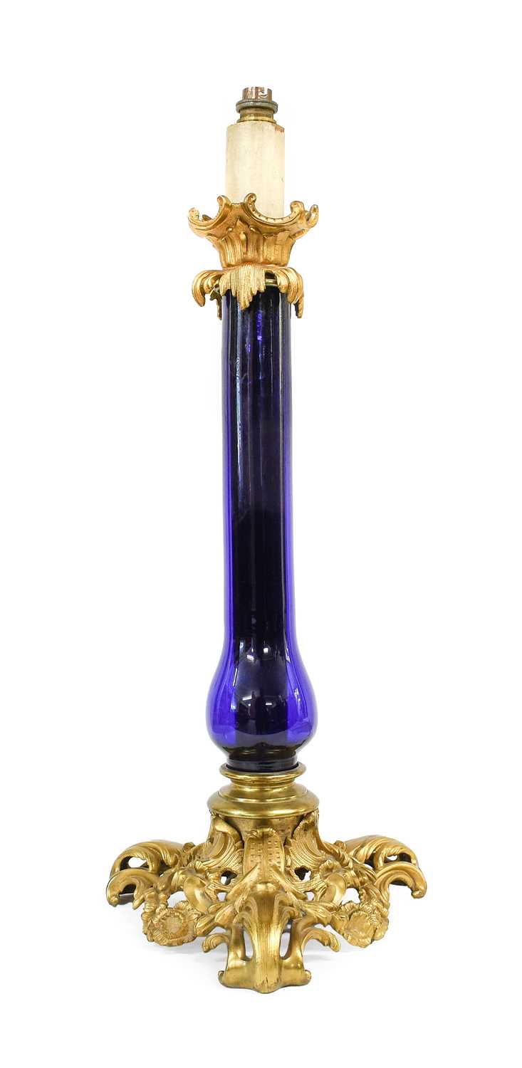 A French Gilt-Metal-Mounted Blue Glass Lamp Base, in Louis XVI style, the scroll and leaf-sheathed