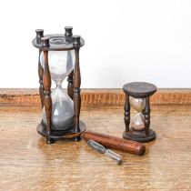 An Hourglass Sermon Timer, 19th century, in lignum vitae frame and with volcanic sand 17.5cm high