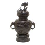 A Japanese Bronze Koro, Cover and Stand, Meiji period, of ovid form with peacock finial and elephant