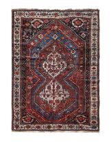 Khamseh Rug South West Iran, circa 1920 The lozenge-shaped field with two stepped ivory medallions