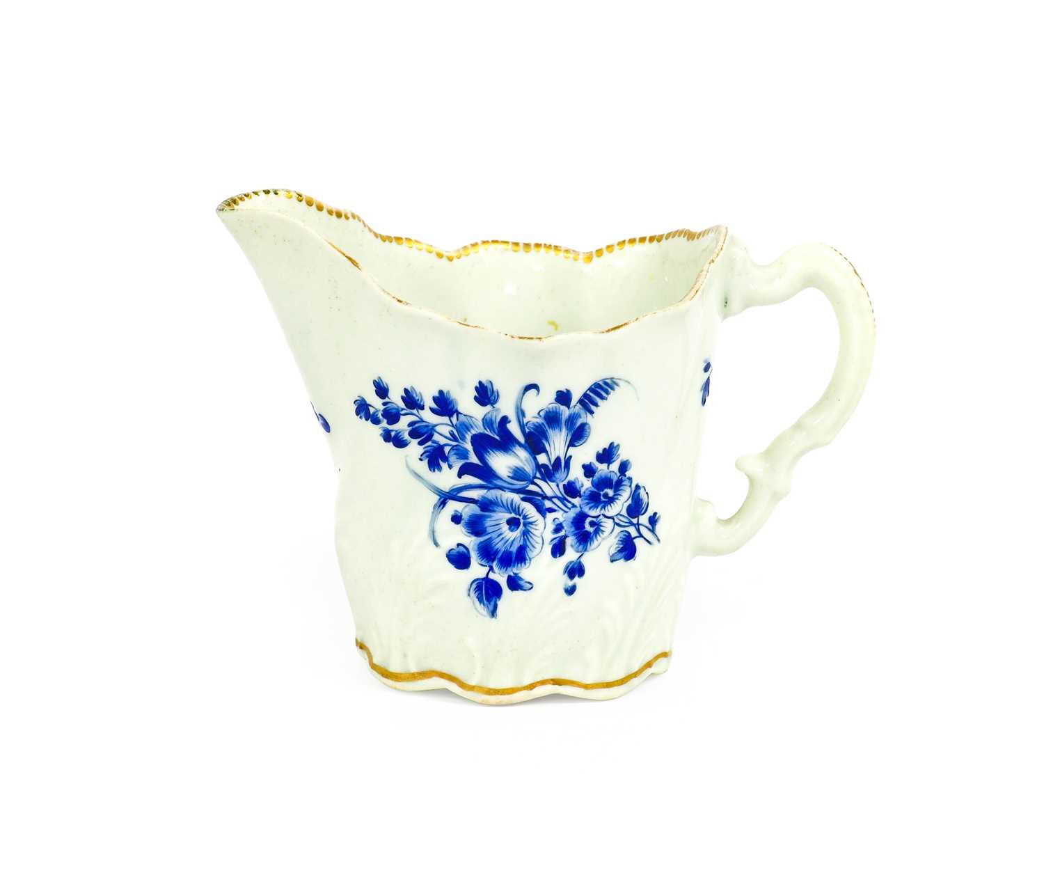 A Worcester Porcelain Cream Boat, circa 1770, of high Chelsea ewer form, with scrolling handle and