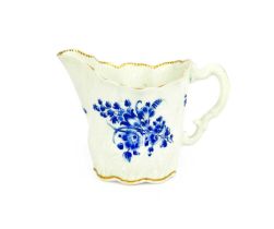 A Worcester Porcelain Cream Boat, circa 1770, of high Chelsea ewer form, with scrolling handle and