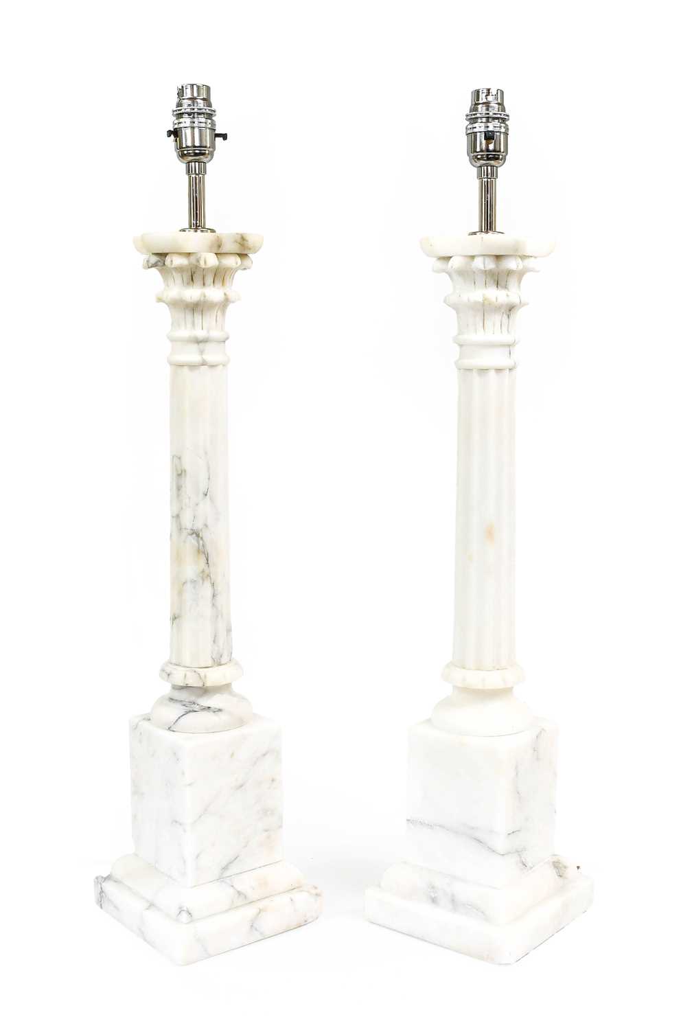 A Pair of Veined Alabaster Lamp Bases, in 18th century style, with leaf-sheathed capitals and fluted