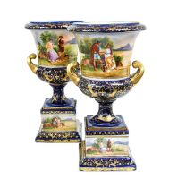 A Pair of Vienna Style Porcelain Campana Urns, first half of the 20th century, ground in cobalt