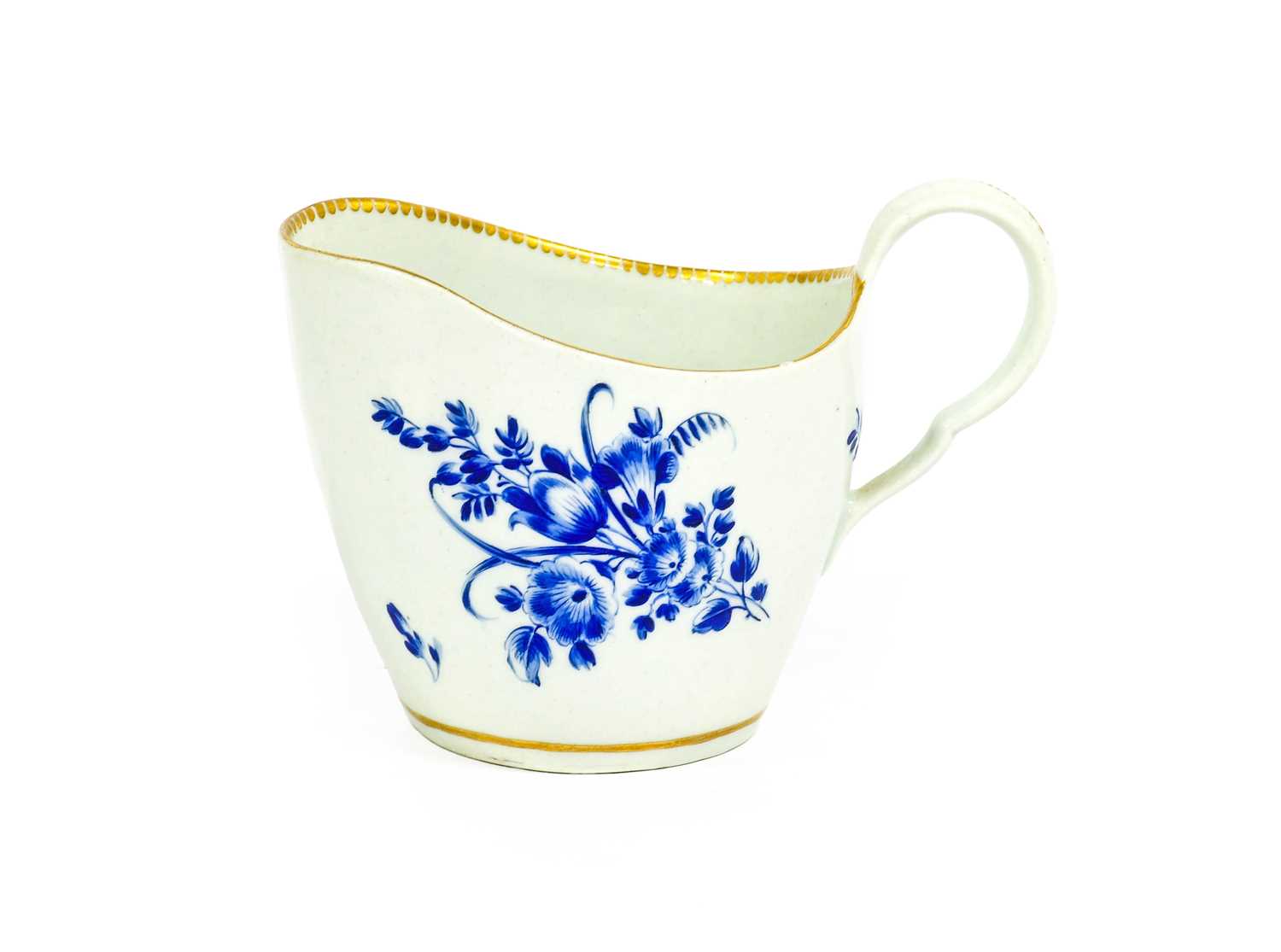 A Worcester Porcelain Cream Jug, circa 1770, of ovoid form and with scrolling handle, decorated with